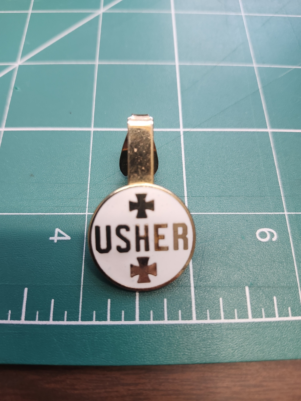 Usher Gold and White Enamel Logo Brooch Tie Clip